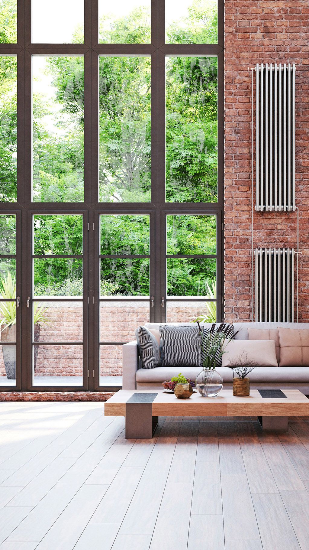 Interior of a modern home with a wood floor and brick wall