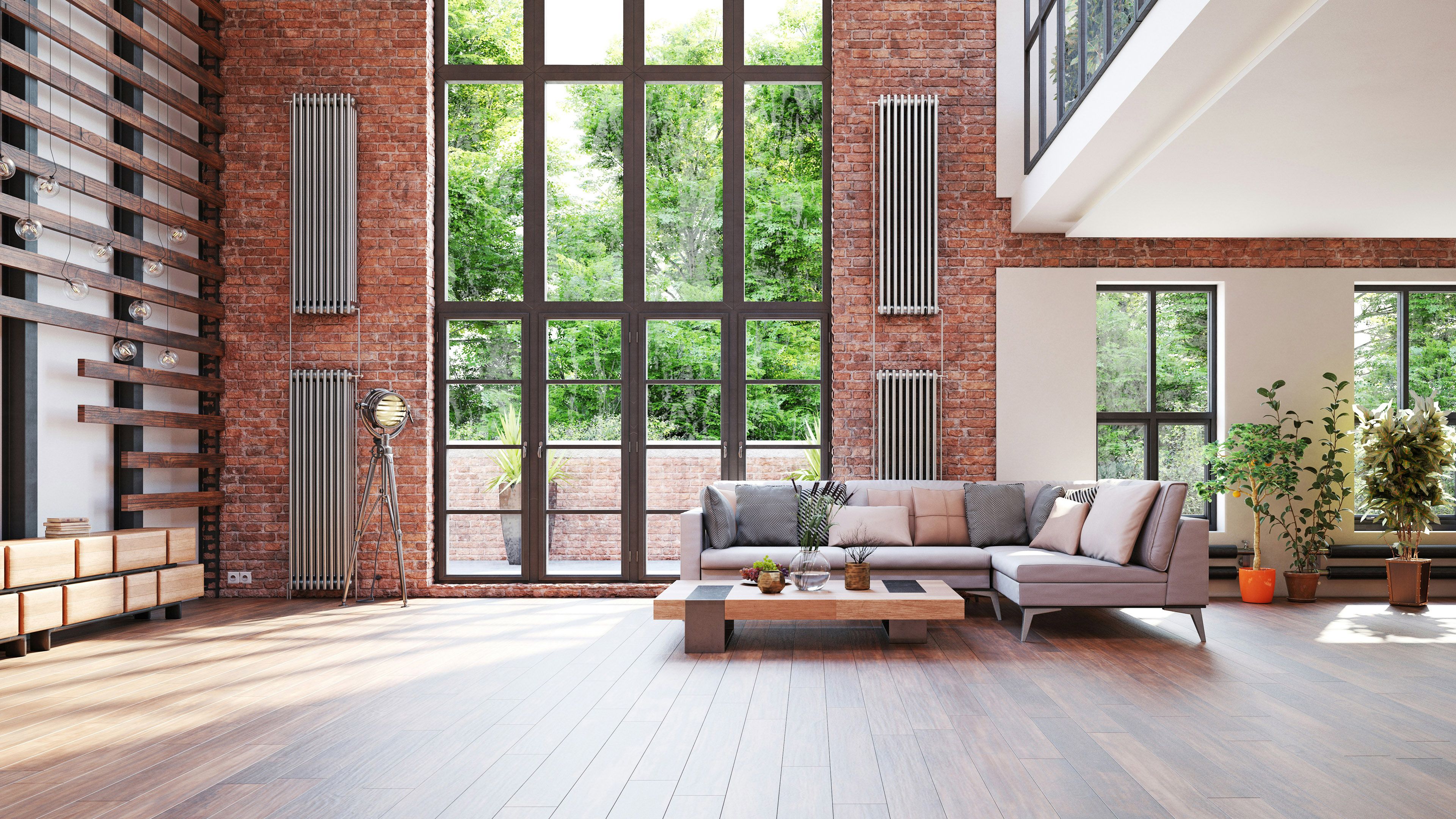 Interior of a modern home with a wood floor and brick wall