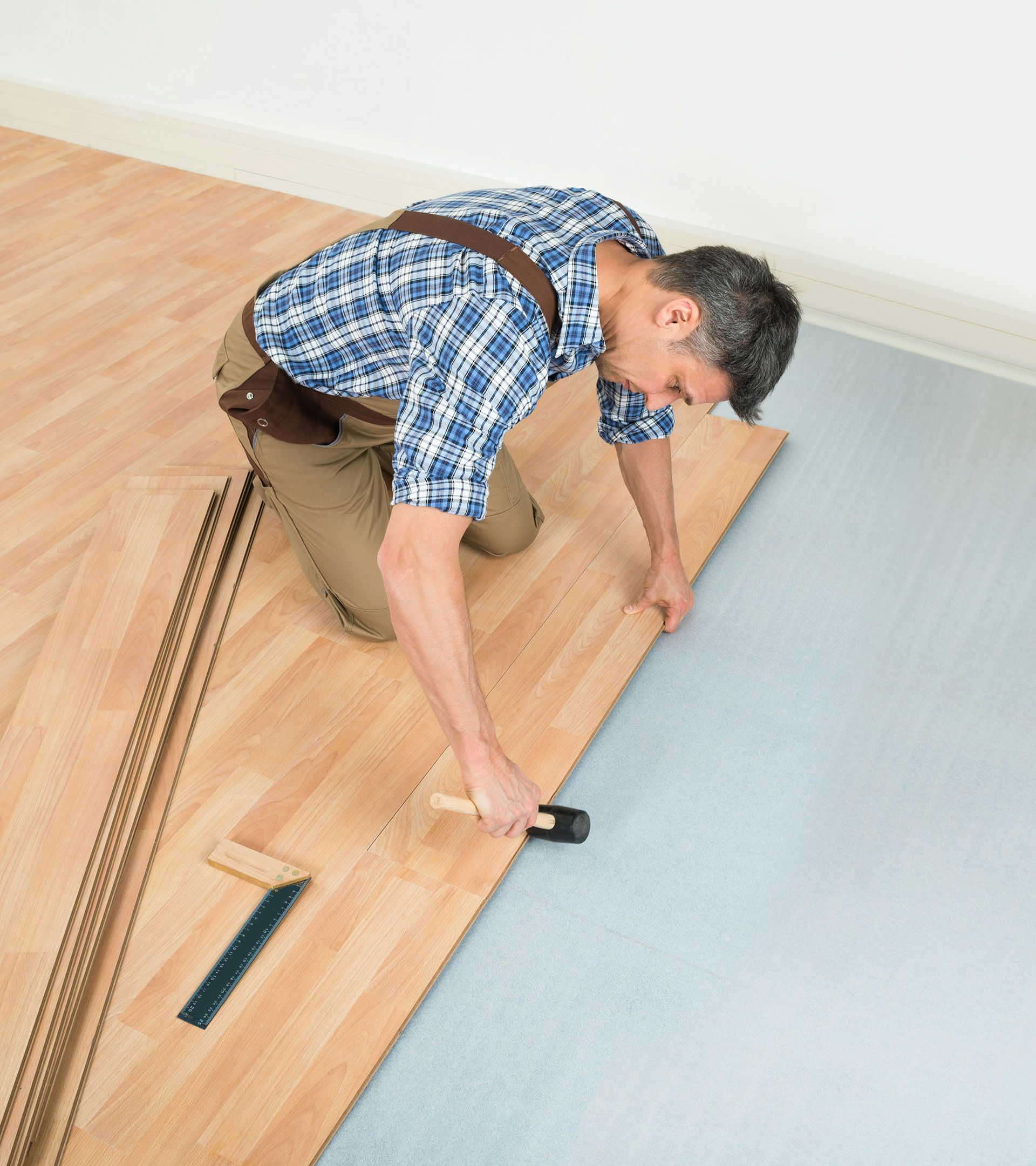 Man installing hardwood flooring